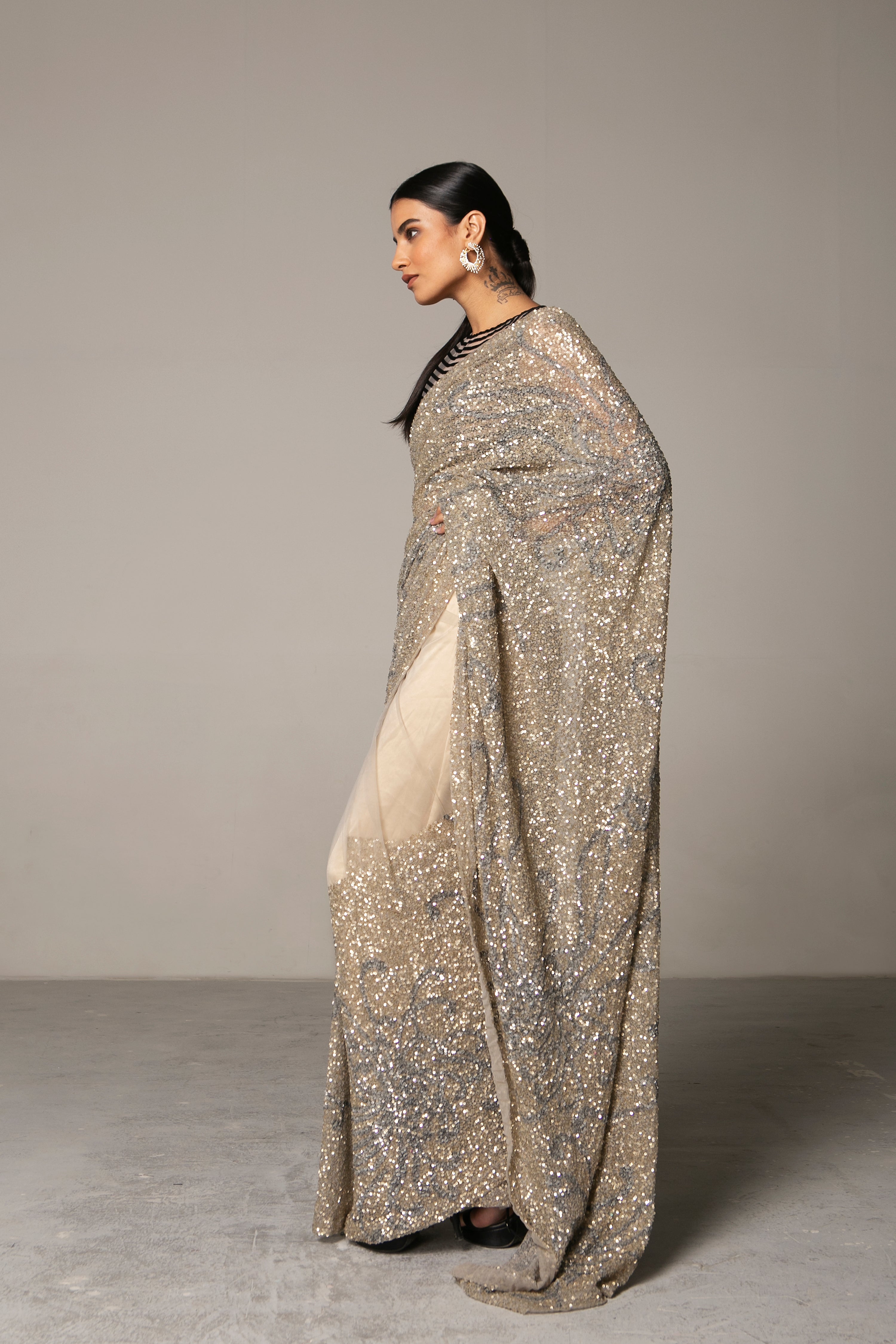 Sabyasachi - Hand painted and printed chiffon sarees with embroidered  borders are paired with sequin-embroidered blouses. Custom print artwork  created by Sabyasachi Mukherjee for the Sabyasachi Art Foundation. The  looks are accessorised